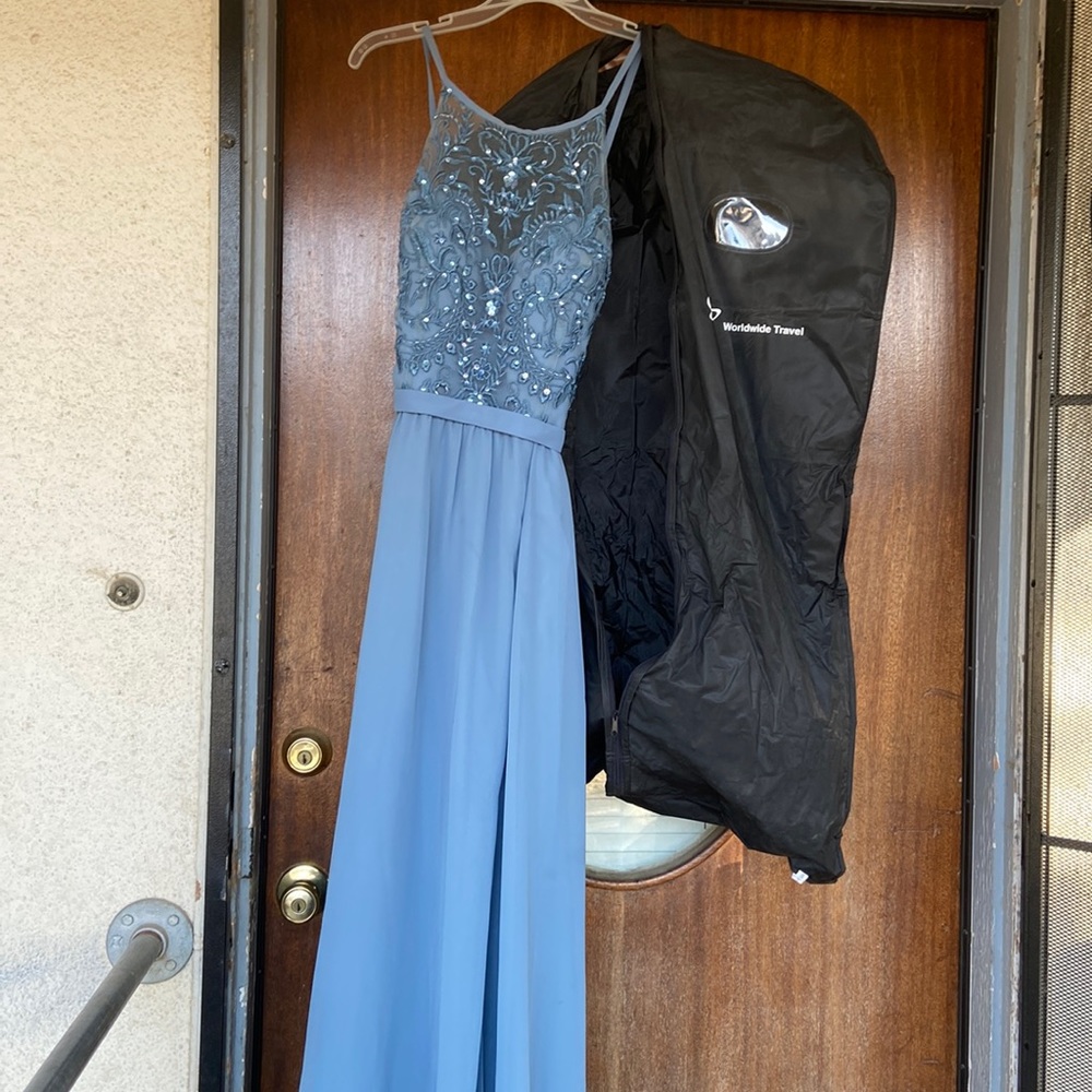 Long dress has slit in front and pockets with built up n bra